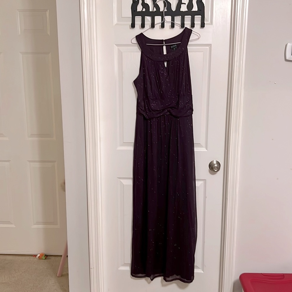 Purple sleeveless glitter dress.